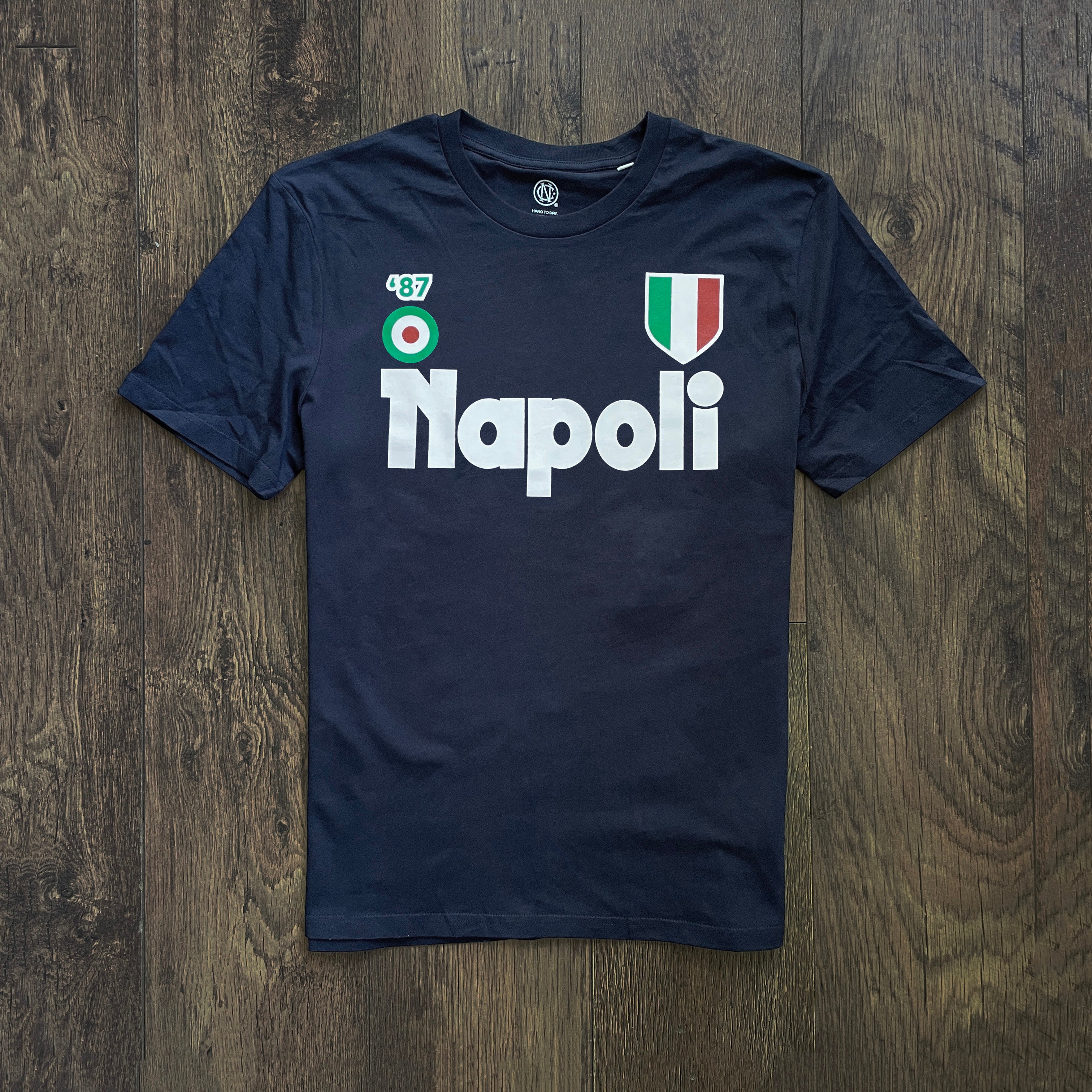 Napoli 1987 mens fashion football t-shirt with logo on a wooden surface